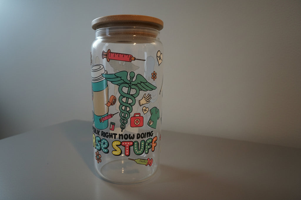 Clear water bottle with colorful graphic design on a white surface